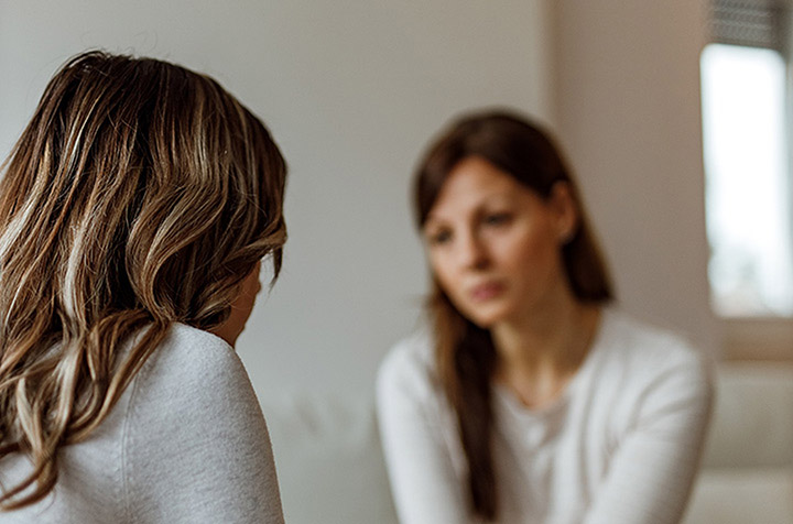 A Mississauga social worker and her female client deep in conversation.